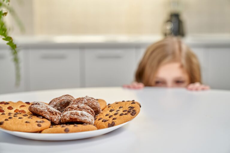 girl looking at cookies