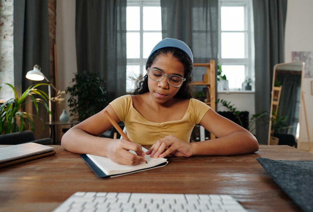 teen girl writing